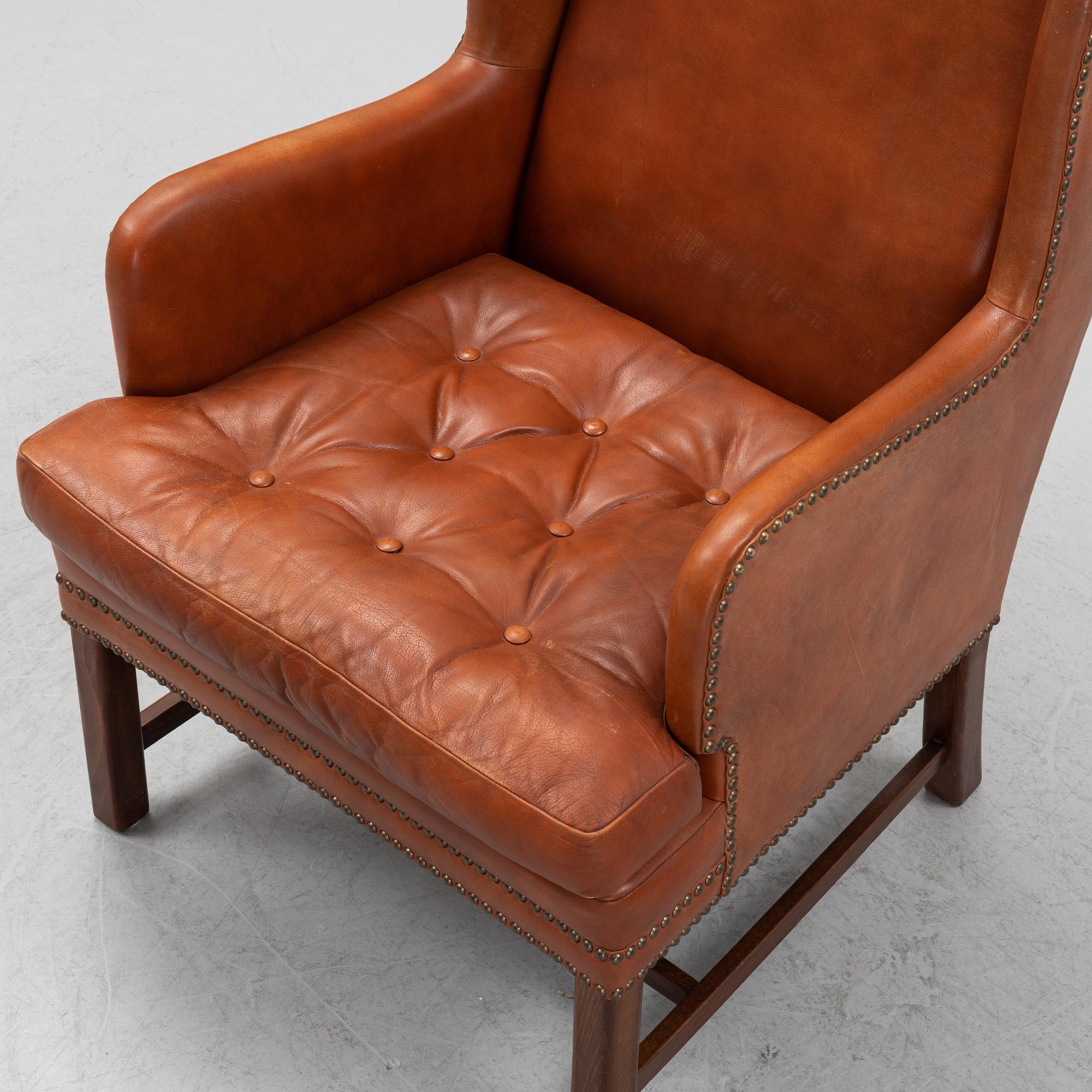 A leather upholstered easy chair, second part of the 20th Century.