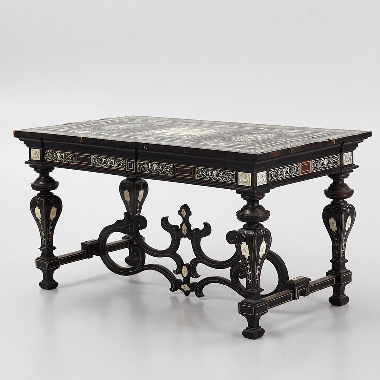 A Renaissance-style ebony, ebonized and ivory-inlaid library table, late 19th century, presumably Germany.