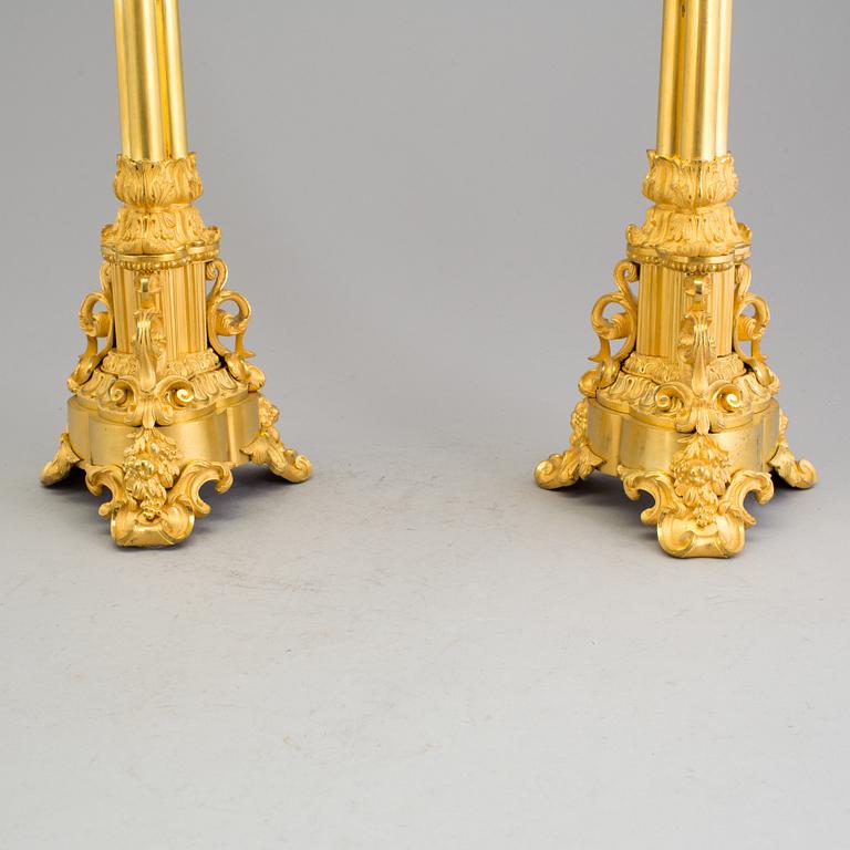 A pair of mid 19th century Empire gilt bronze candelabras.