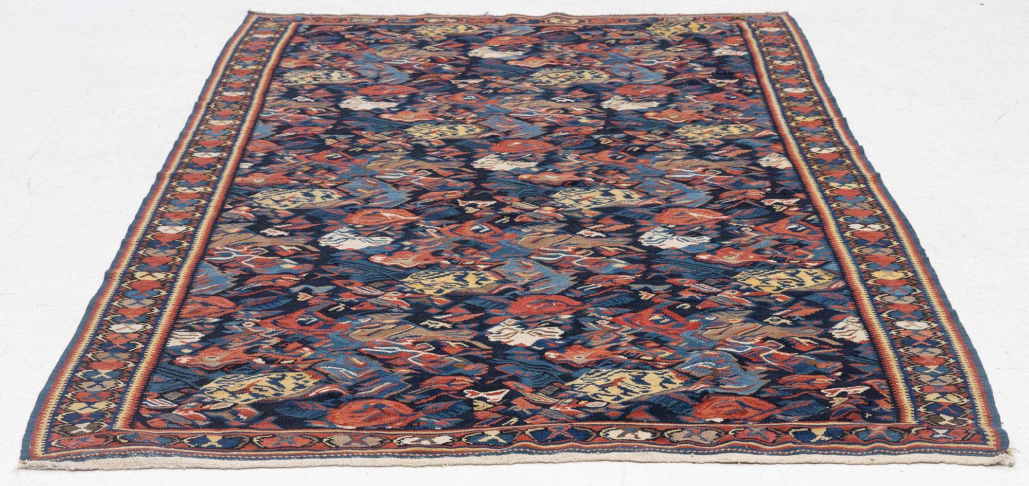 A Kilim rug, Senneh, approx. 199 x 132 cm.