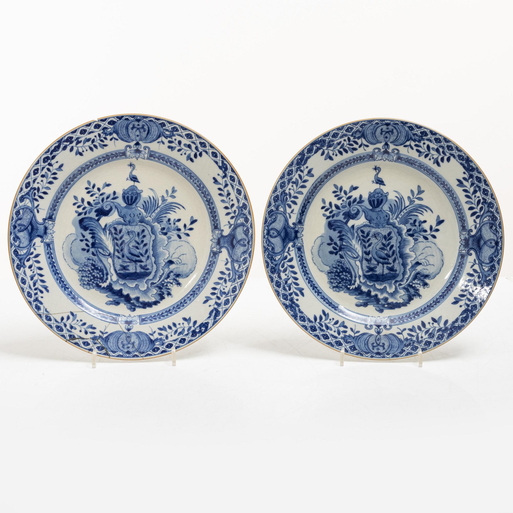 A pair of armorial dinner plates, soft paste, Qing dynasty, 18th century.