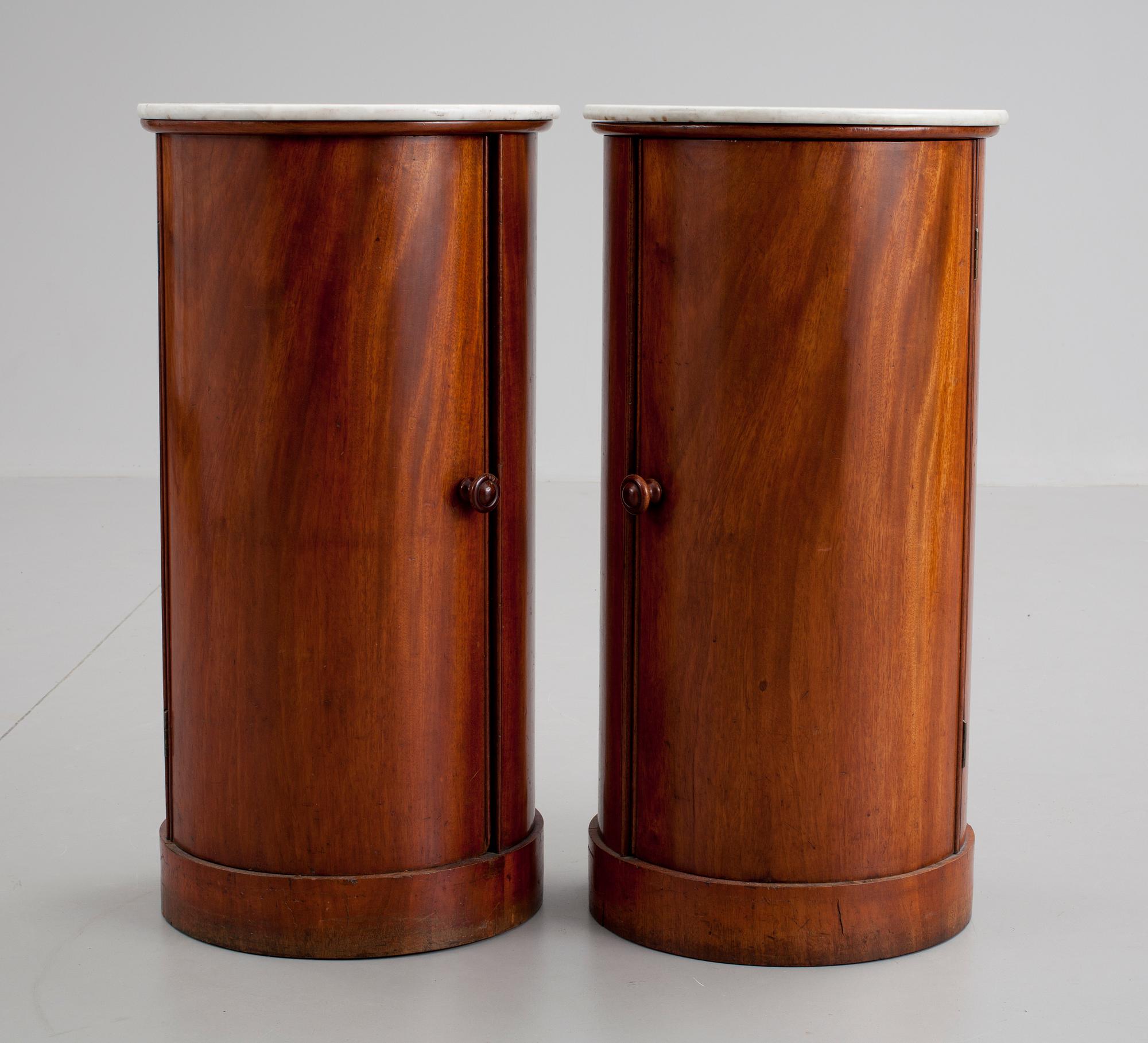 A pair of Empire 19th cent mahogany cupboards.