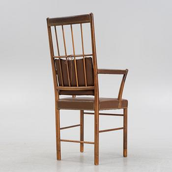 Josef Frank, a model 652 mahogany armchair, Svenskt Tenn, mid 20th Century.