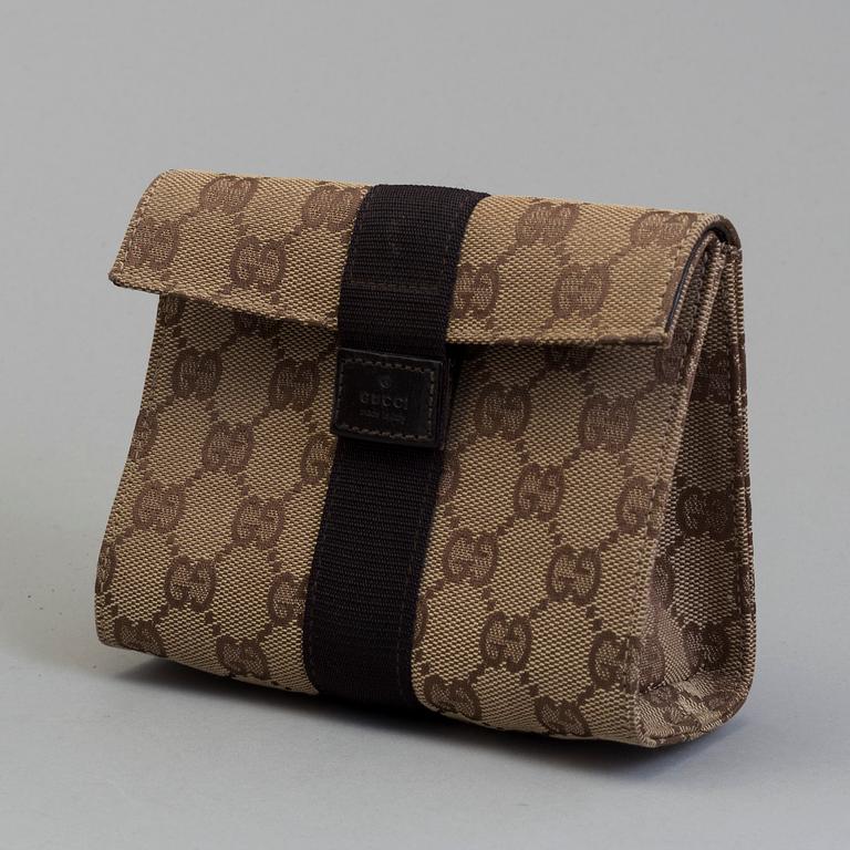 GUCCI, a monogram fabric hand bag and beauty bag.