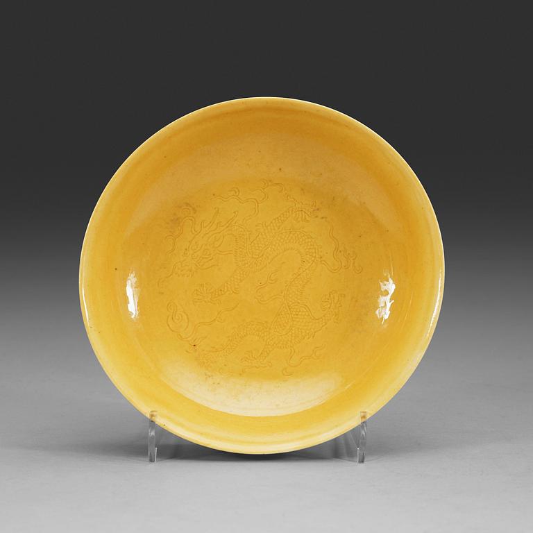 A Yellow glazed dish, Qing dynasty, with Daoguang seal mark and period (1821-1850).