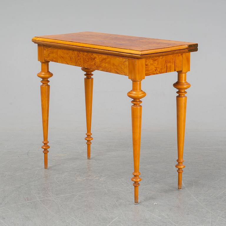 An early 20th Century birch card table.