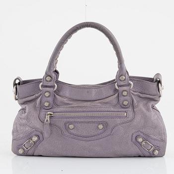 Balenciaga, a purple leather 'City' handbag.