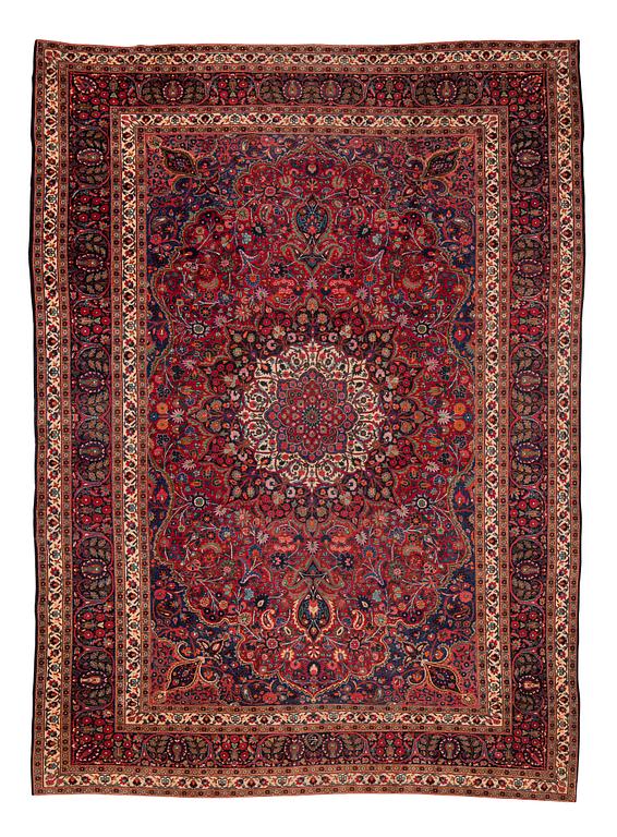 A carpet, semi-antique Mashad/Moud, ca 292 x 214 -218 cm.