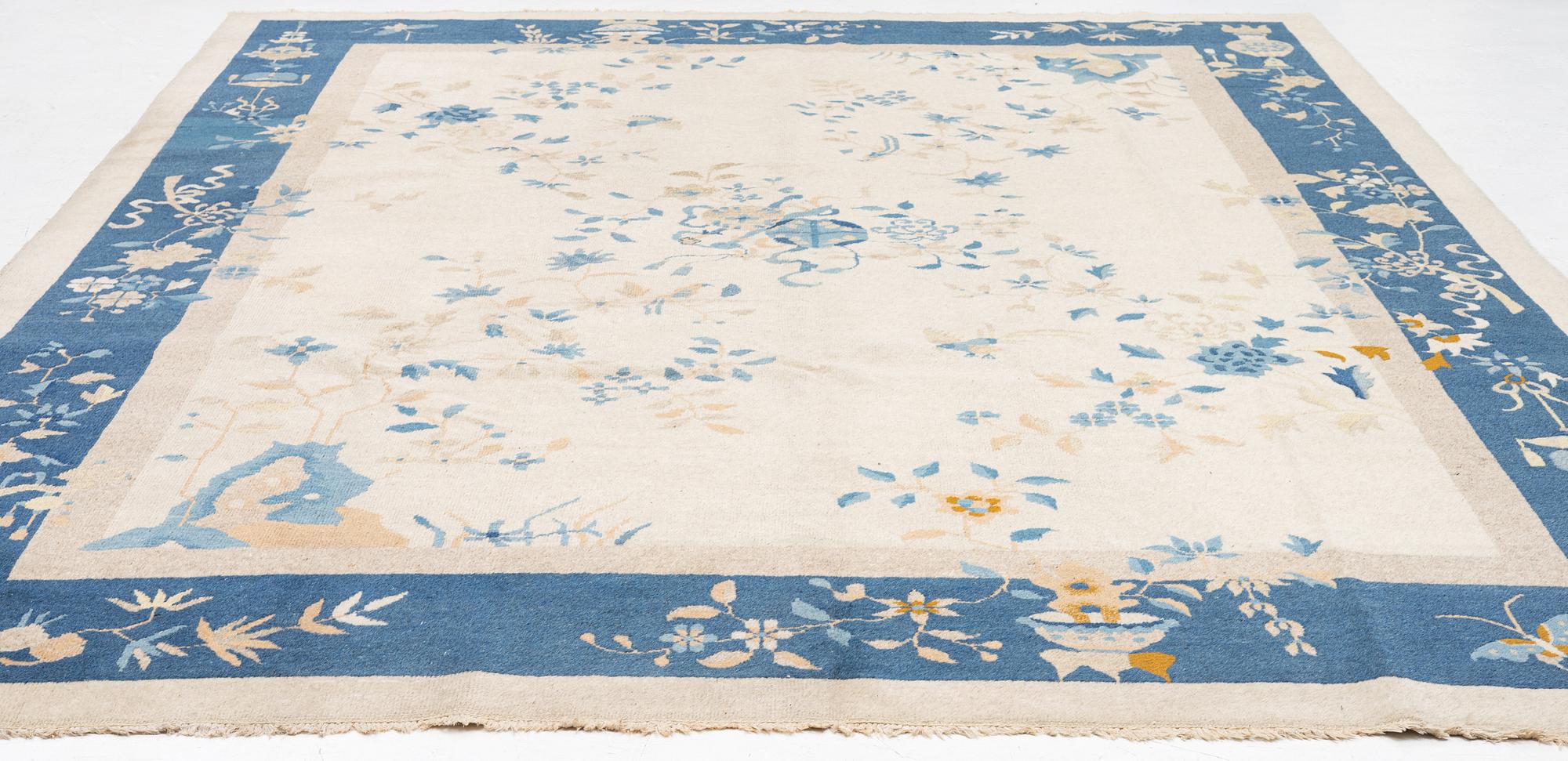 A semi-antique China/Nepal carpet, c, 385 x 297 cm.