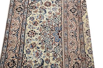 A Nain rug, part silk, 9 laa, c. 204 x 125 cm.