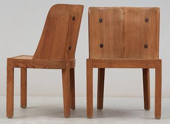 A pair of Axel Einar Hjorth stained pine 'Lovö' chairs by Nordiska Kompaniet, 1930's.