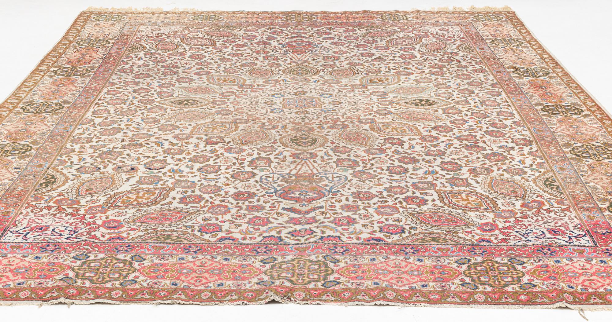 A Tabriz carpet, c. 390 x 305 cm.