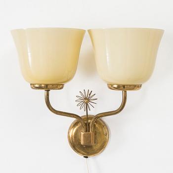 A mid-20th century wall light for Korumo.