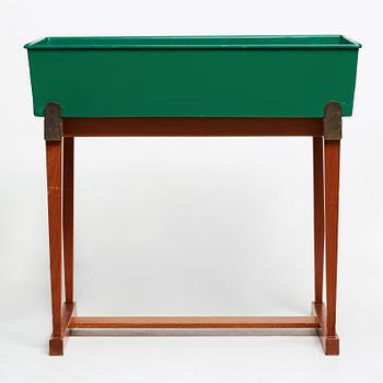 Josef Frank, a mahogany and tin flower stand,  Svenskt Tenn Sweden 1950-60's, model no 2084.