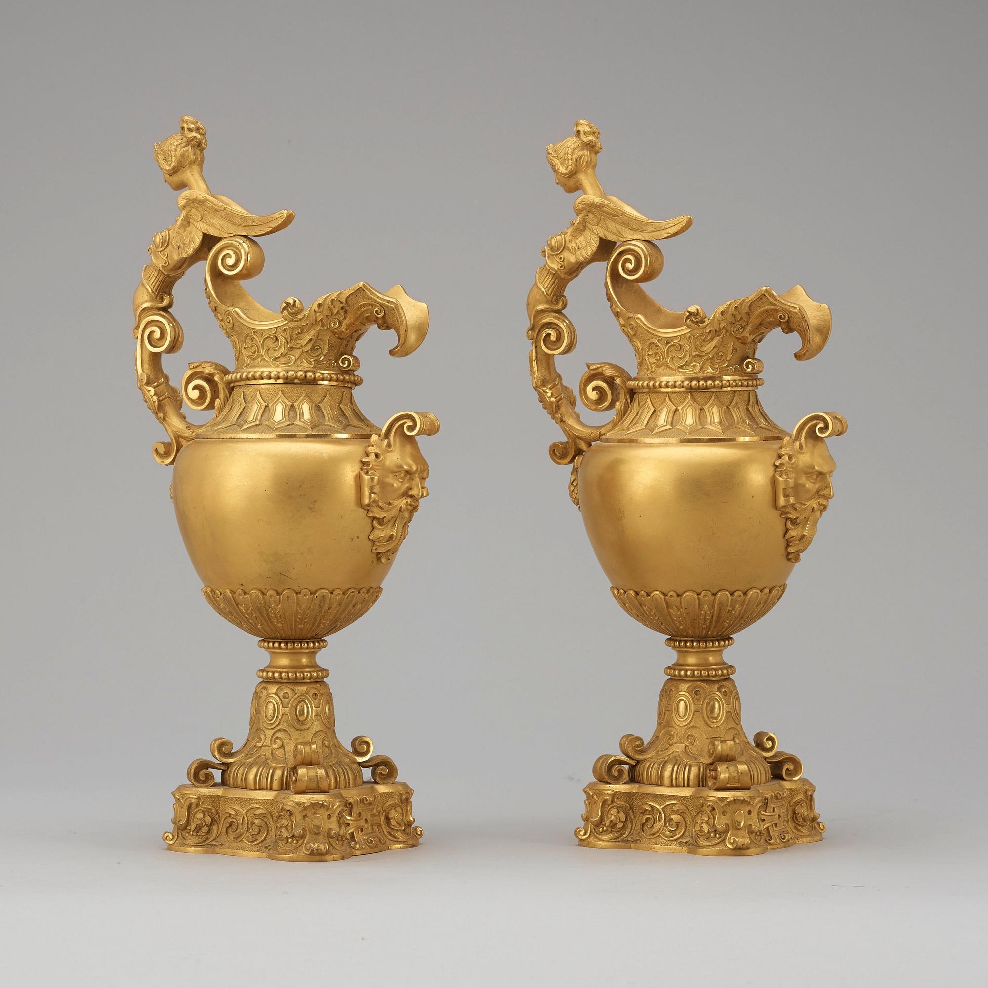 A pair of mid 19th century gilt bronze ornamental ewers.