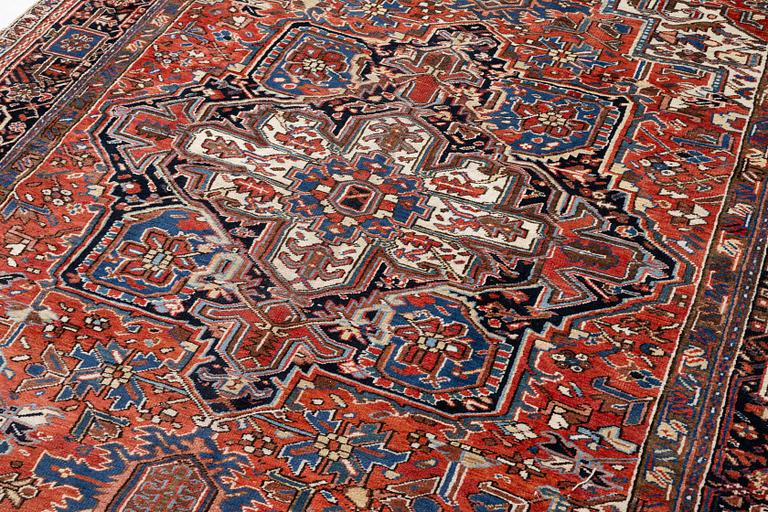An antique Heriz carpet, west Persia, c. 333 x 238 cm.