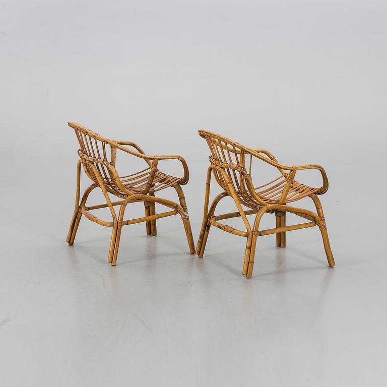 A PAIR OF RATTAN ARMCHAIRS.