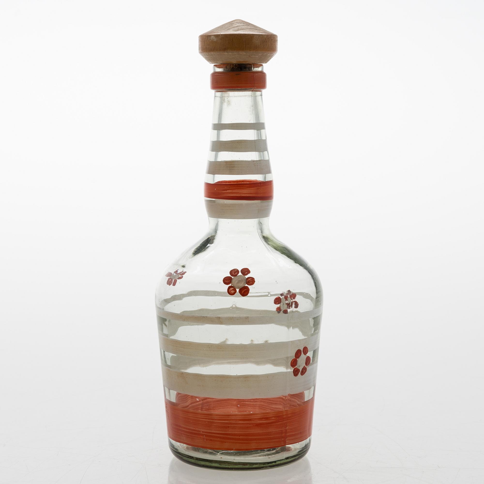 A set of 6 snapsglasses and a bottle designed by Aino Aalto for Karhula in the 1930-1940's.