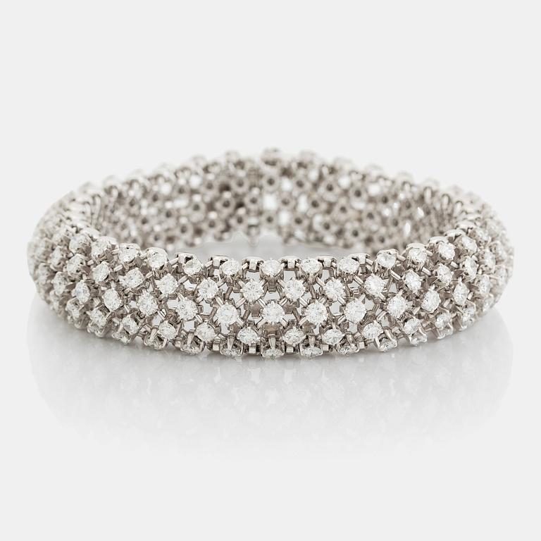 A platinum bracelet set with round brilliant-cut diamonds.