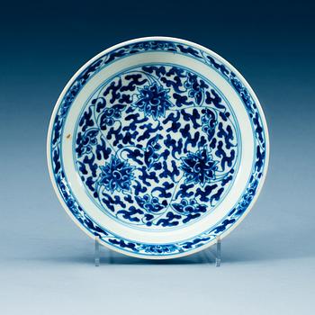 1940. A set of four blue and white lotus dishes, Qing dynasty, with Kangxi six character mark.