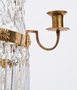 A late Gustavian gilt brass and cut glass seven-light chandelier, Stockholm, late 18th century.