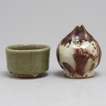 A Korean water dropper from the 19th Century and a celadon bowl, Ming dynasty (1368-1644).