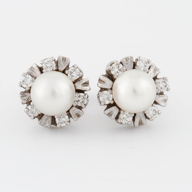 A pair of cultured pearl and brilliant cut diamond earrings.