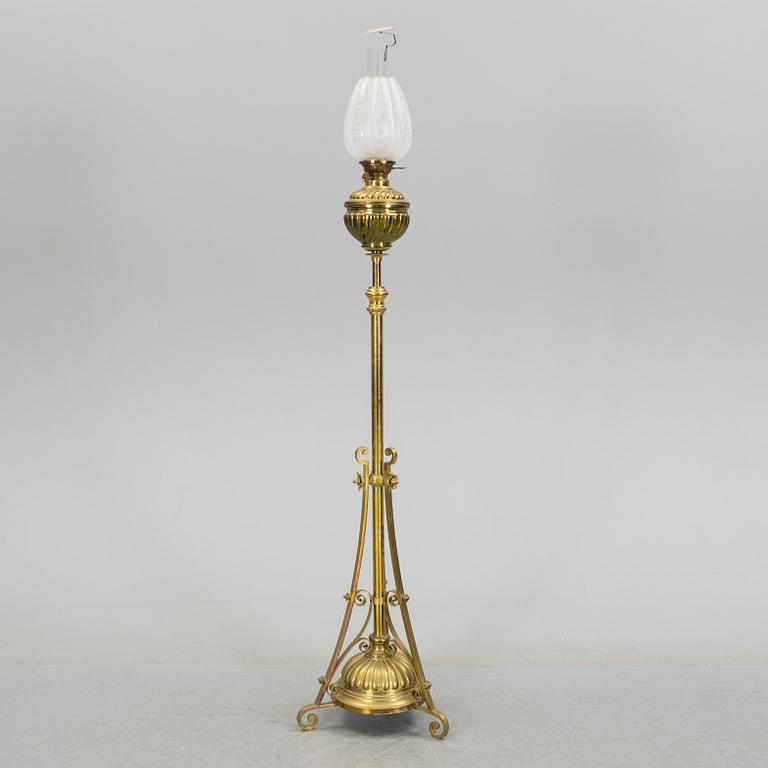 A floor brass paraffin lamp around 1900.