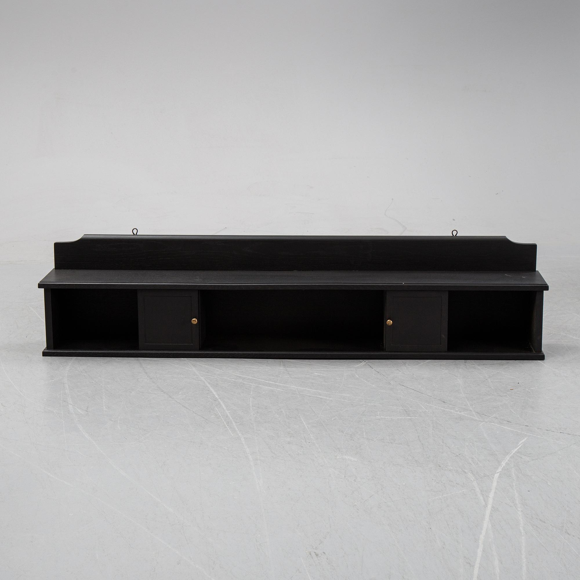 A painted wall shelf, early 20th Century.
