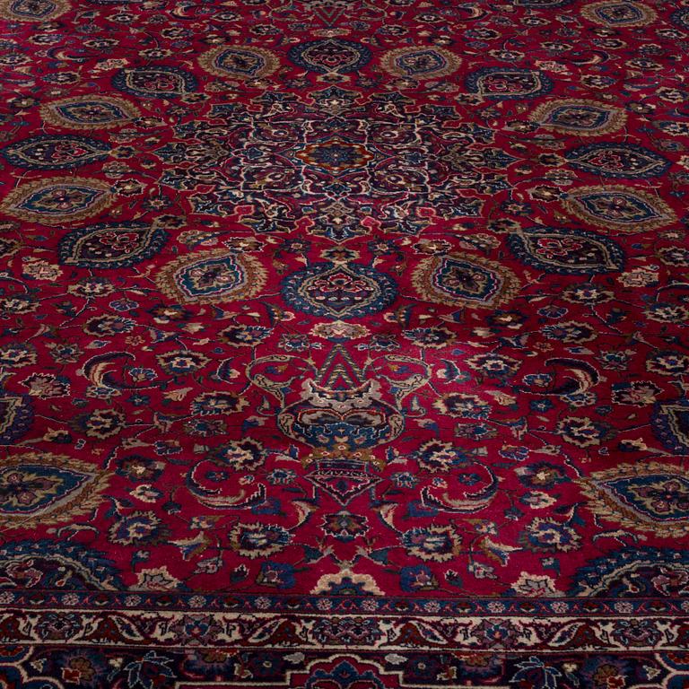 A CARPET, semi-antique, around 382 x 298 cm.