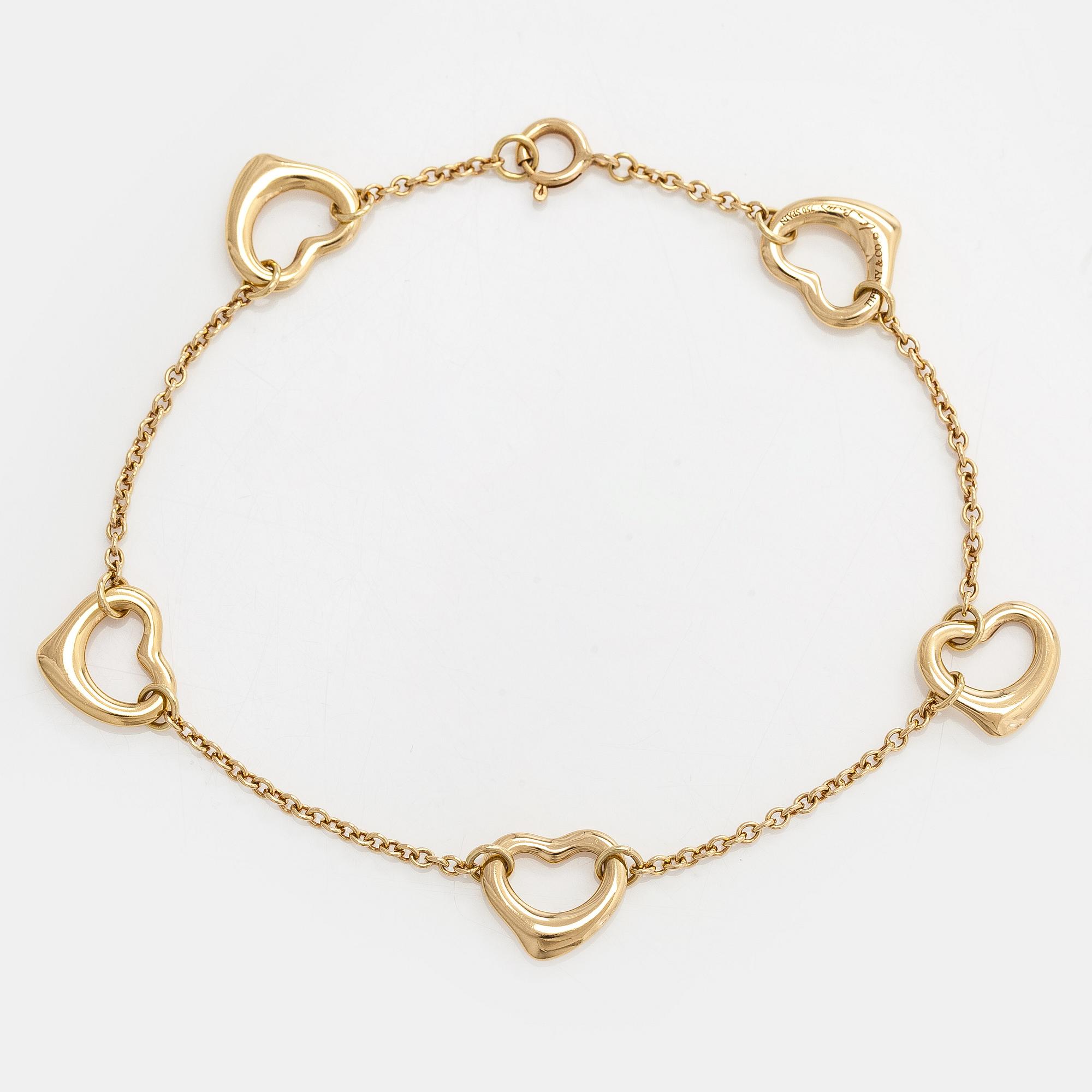 Tiffany & Co, Elsa Peretti, an 18K gold 'Open Heart' bracelet.
