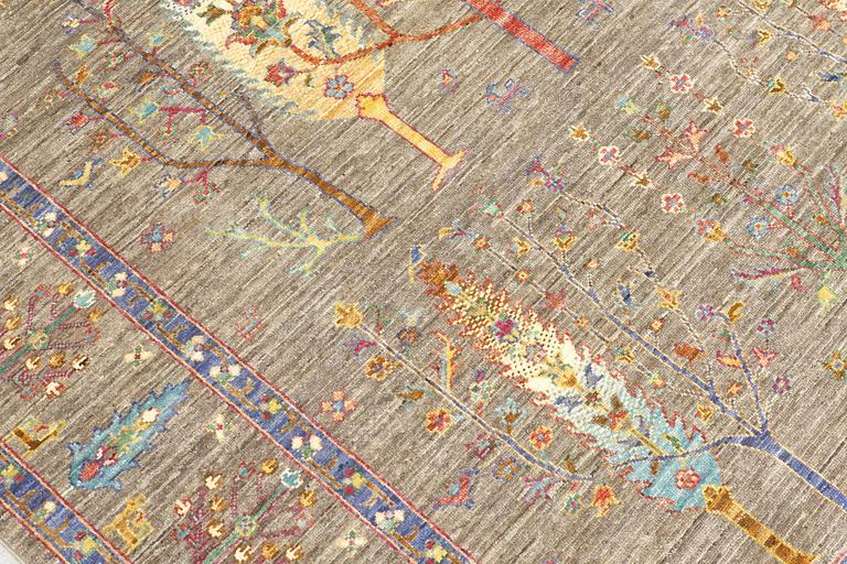 A rug, Ziegler design figural, ca 241 x 169 cm.