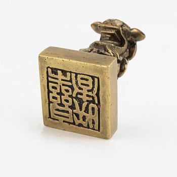 A Chinese bronze seal stamp and a tripod censer, late Qing dynasty, 19th century.