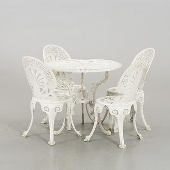 A SET OF FOUR GARDEN CHAIRS AND A GARDEN TABLE, turn of the century 2000.