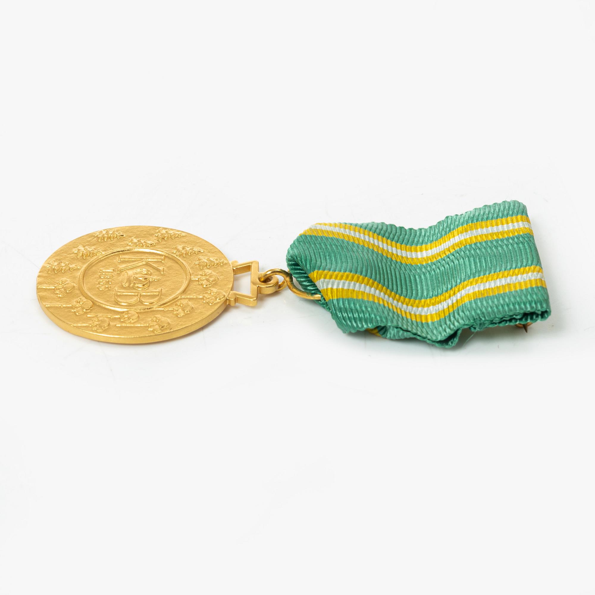 An 18K gold medal, Sporrong, Stockholm 1958.