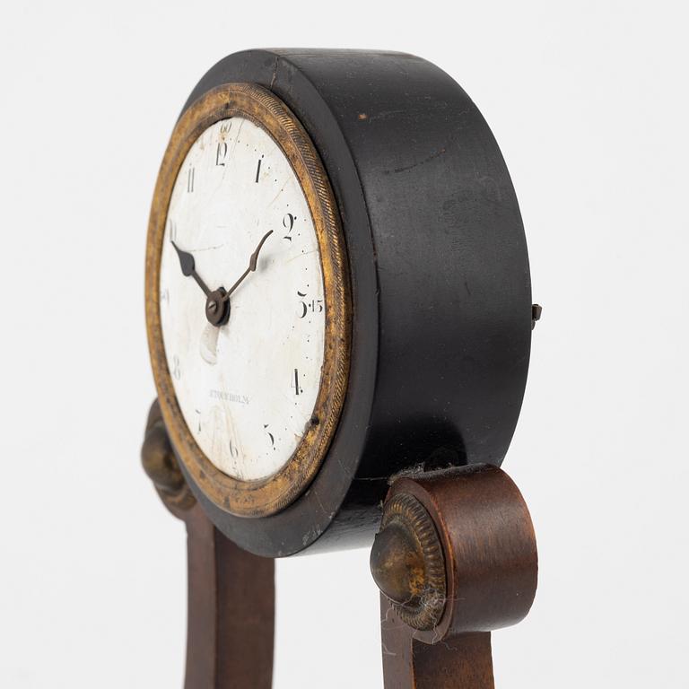 An Empire mantle clock from the 19th century.