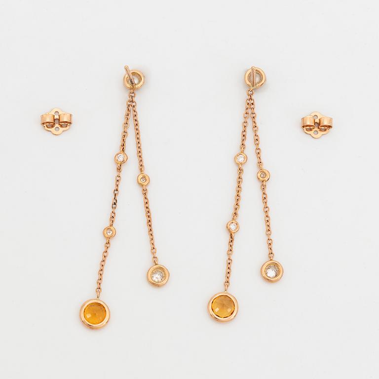 Yellow sapphire and brilliant-cut diamond earrings.