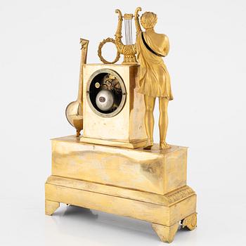 A French Empire ormolu figural mantel clock, early 19th Century.