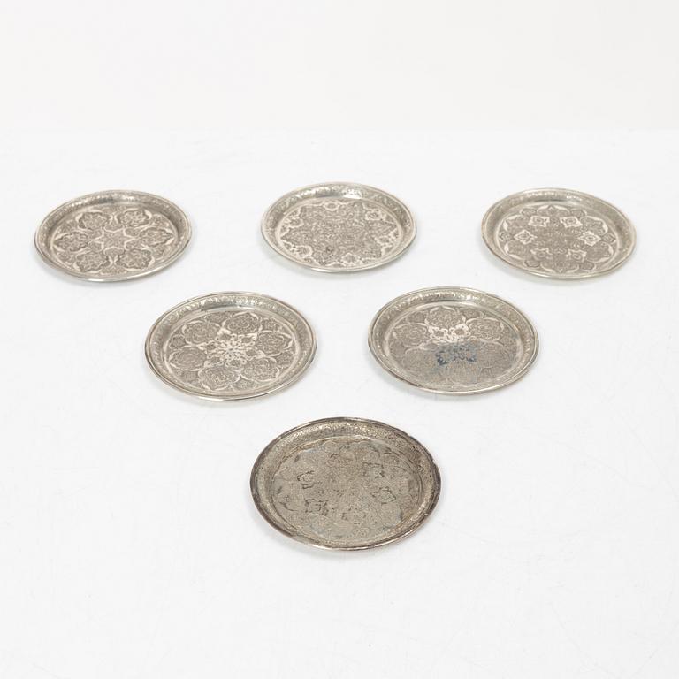 A Persian silver tray, 12 small spoons and six coasters, first part of the 1900s.