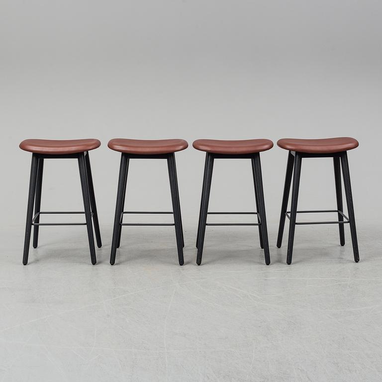 Four contemporary leather upholstred stools by Berlin & Iskos for Muuto.