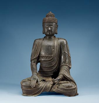 A large bronze figure of Buddha.