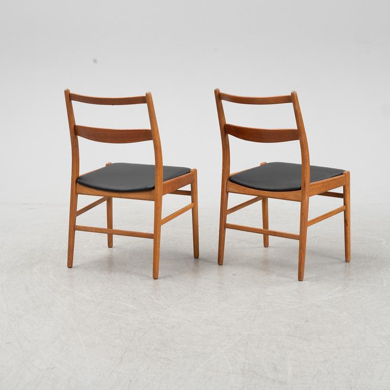 A five-piece teak and oak dining suite, second half of the 20th Century.