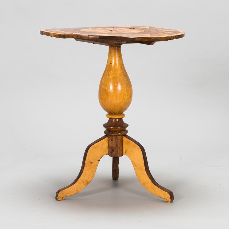 A tilt top table from 19th Century.