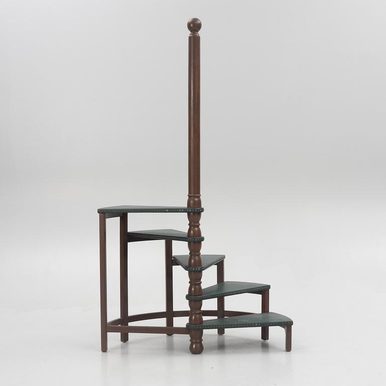 Amid 20th century library ladder.