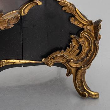 Clock, Rococo style with partially older parts, around the year 1900.