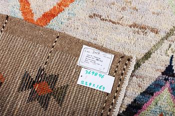 A Moroccan rug, c. 229 x 169 cm.