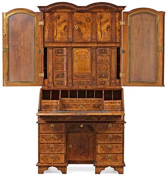 An English early 18th century walnut veneered and gilt bronze Bureau-Cabinet decorated with marquetry in première and contre partie on both sides of a cabinet door "LONDON THE XXV MAY ANNO 1716" under monogram SGB and Marquess's coronet.