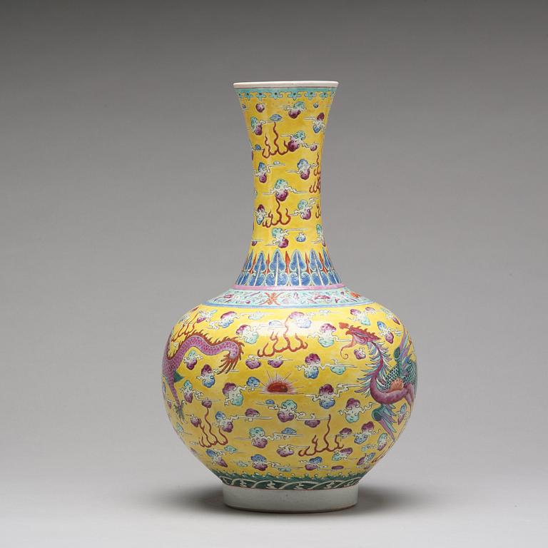 A yellow glazed dragon and phoenix vase, China, circa 1900.