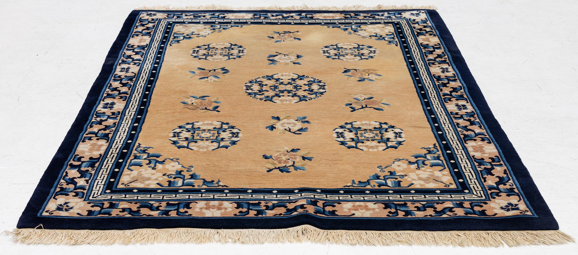 A semi-antique chinese rug, c. 195 x 132 cm .