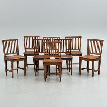 A provincial dining table and eight similar chairs, Sweden, 19th century.